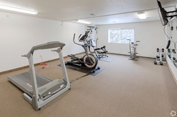 The gym at the whispering winds apartments in pearland, tx